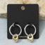 Huggie Earrings With Dangling Teardrop Charm: TT