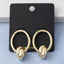 Polished Knot Charm Oval Hoop Earrings: TT