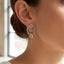 Polished Knot Charm Oval Hoop Earrings: TT